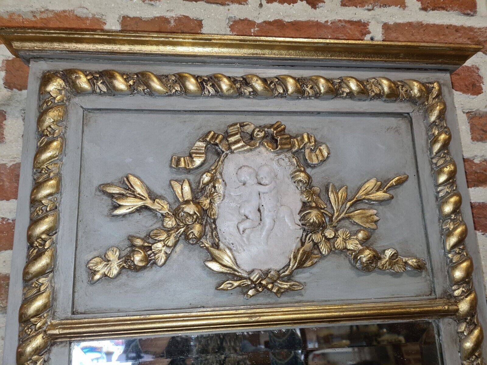 gray and gold patinated trumeau mirror