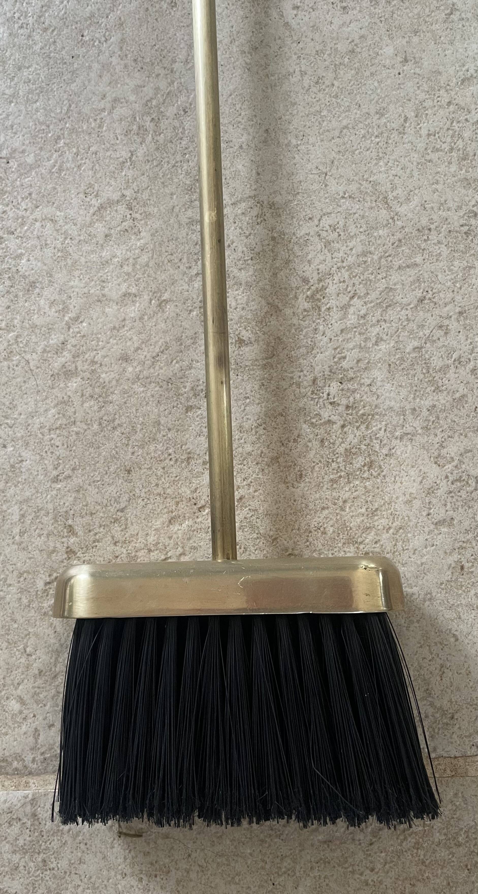 Brass fireplace tools in the style of Maison Baguès.