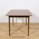 Extendable teak dining table in Mid-Century style from McIntosh, UK.