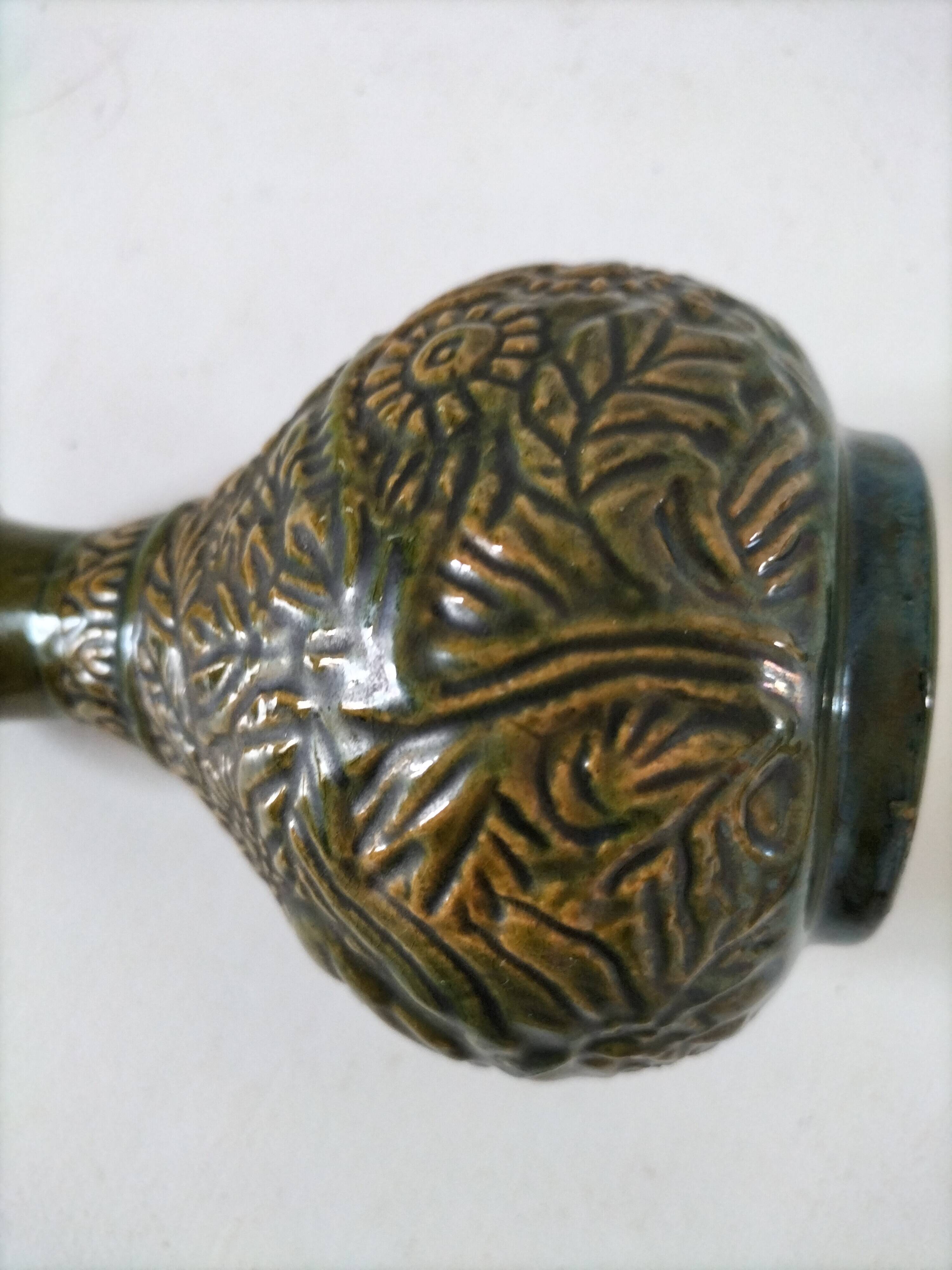 Small glazed vase with raised floral decoration