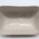Slurry butter dish, with radish drawings. Signed "FG"