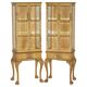 Pair of Art Deco display cabinets circa 1920 in light walnut with Cabriolet legs.