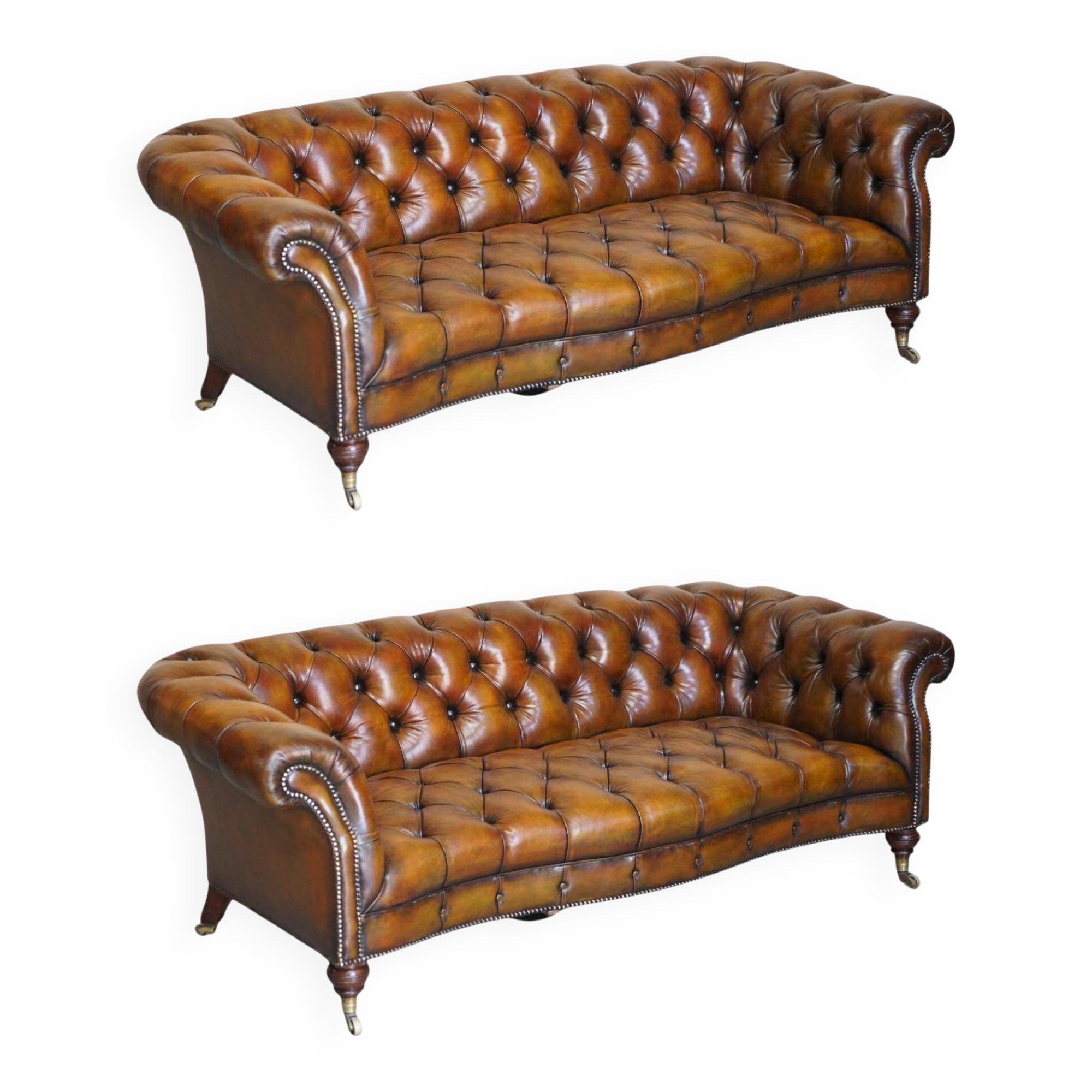 Pair of leather Chesterfield sofas by Howard & Sons