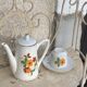 Porcelain dinette for dolls consisting of a coffee maker, cups and saucers, vintage