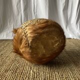 Handwoven vintage basket with handles made from natural fibres.