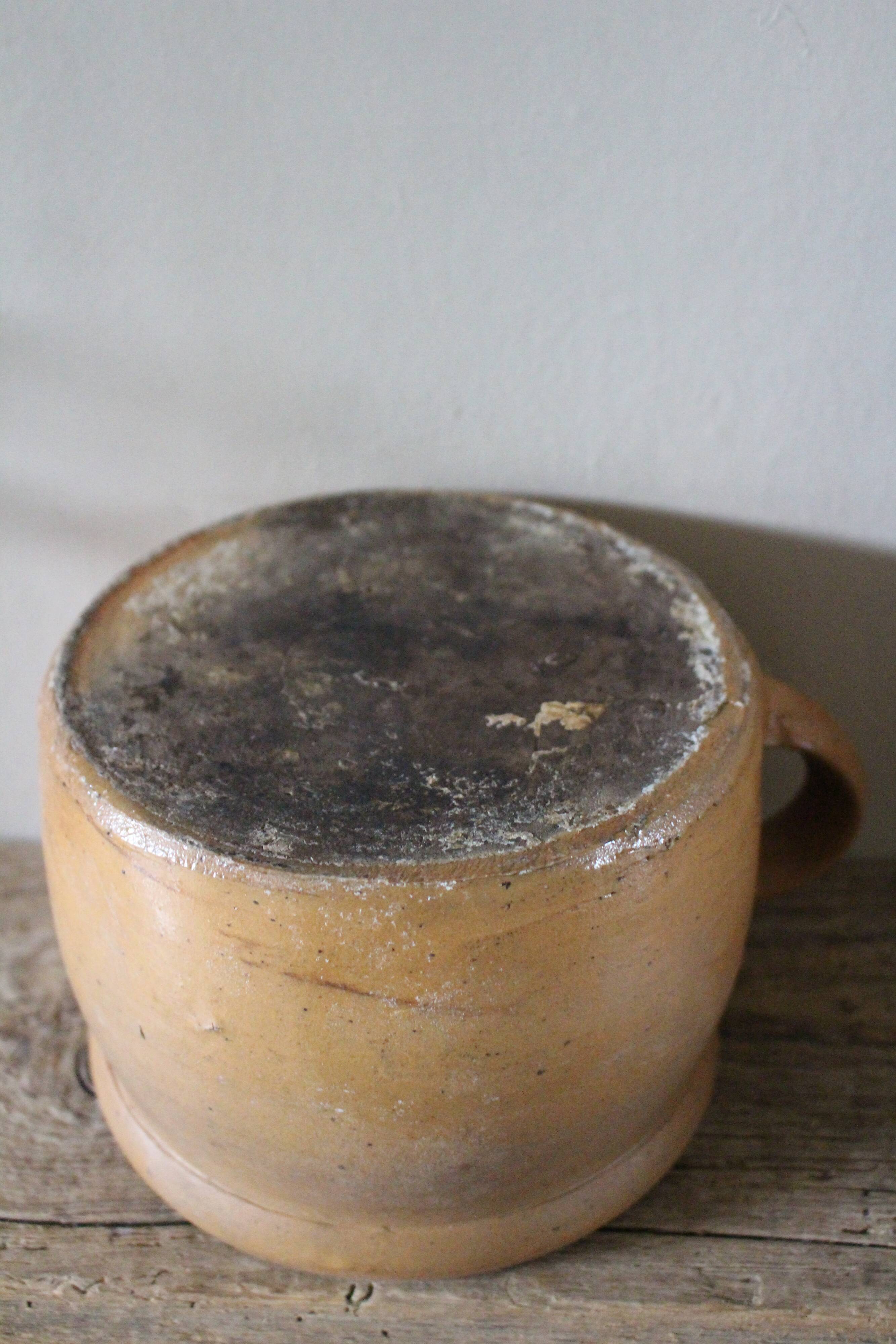 Round terracotta milk jug with handle