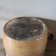 Round terracotta milk jug with handle