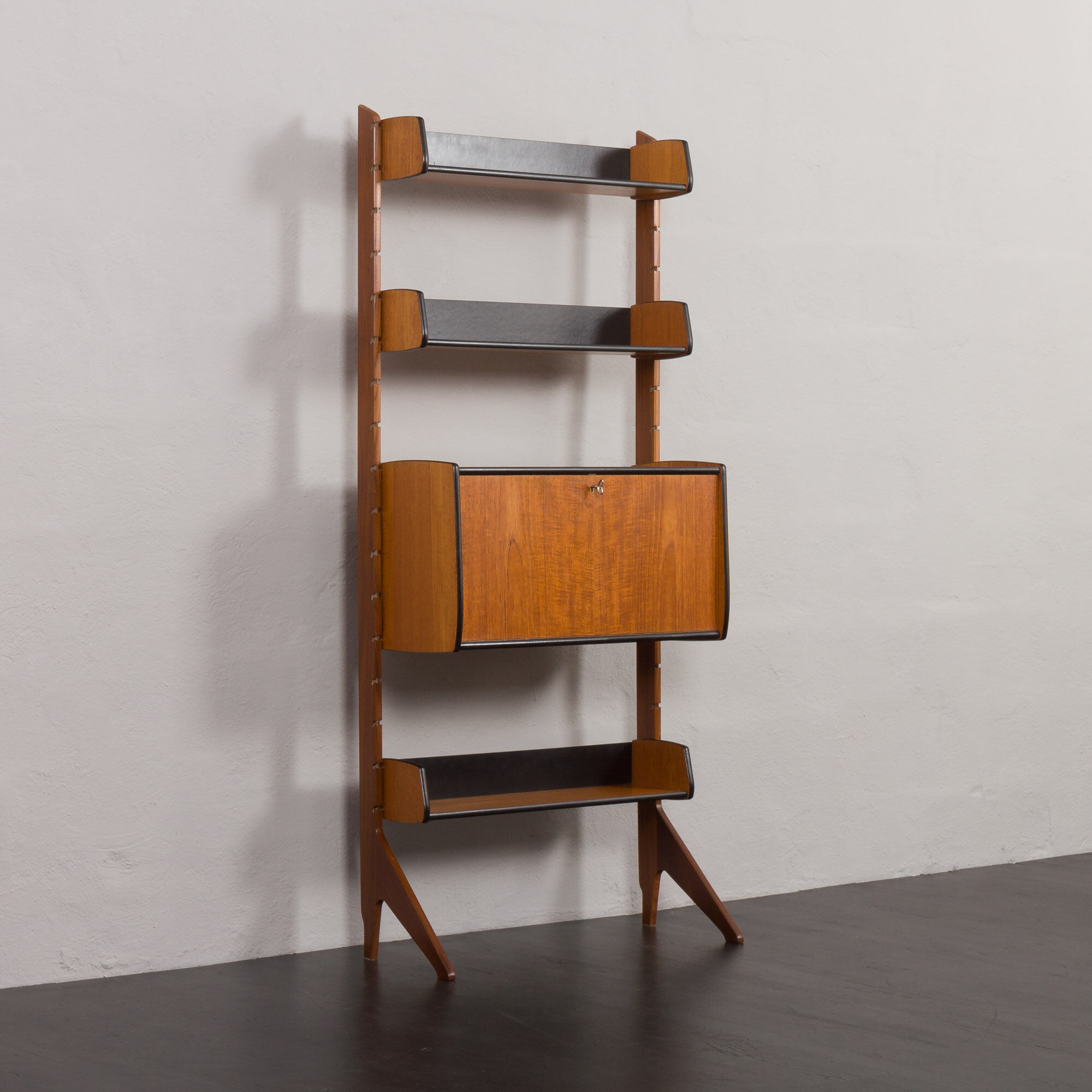 Scandinavian free standing vertical bookcase with a secrtetaire or home office wall unit model Ergo,