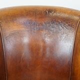 Set of 2 cognac-colored sheepskin club chairs with colorful fabric cushions