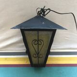 Old black forged iron suspension vintage in moulded glass