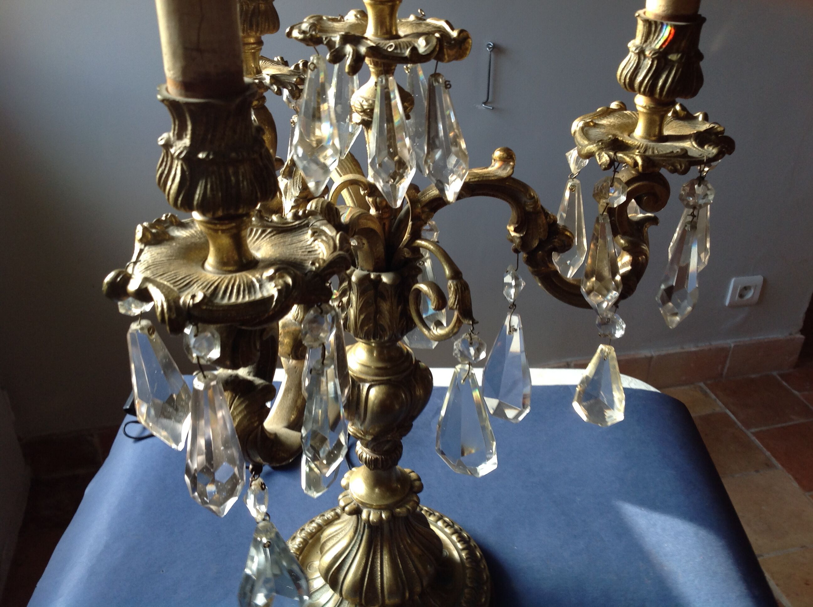 Girandolle in bronze and stamps, early 20th