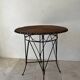 Vintage round table in woven rattan and black wrought iron – 1950s / 1960s