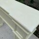 Fireplace surround with beige solid wood mantel