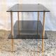 Coffee table in gilded metal and smoked glass – 60s