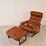 Vintage leather armchair with hocker, 1970s