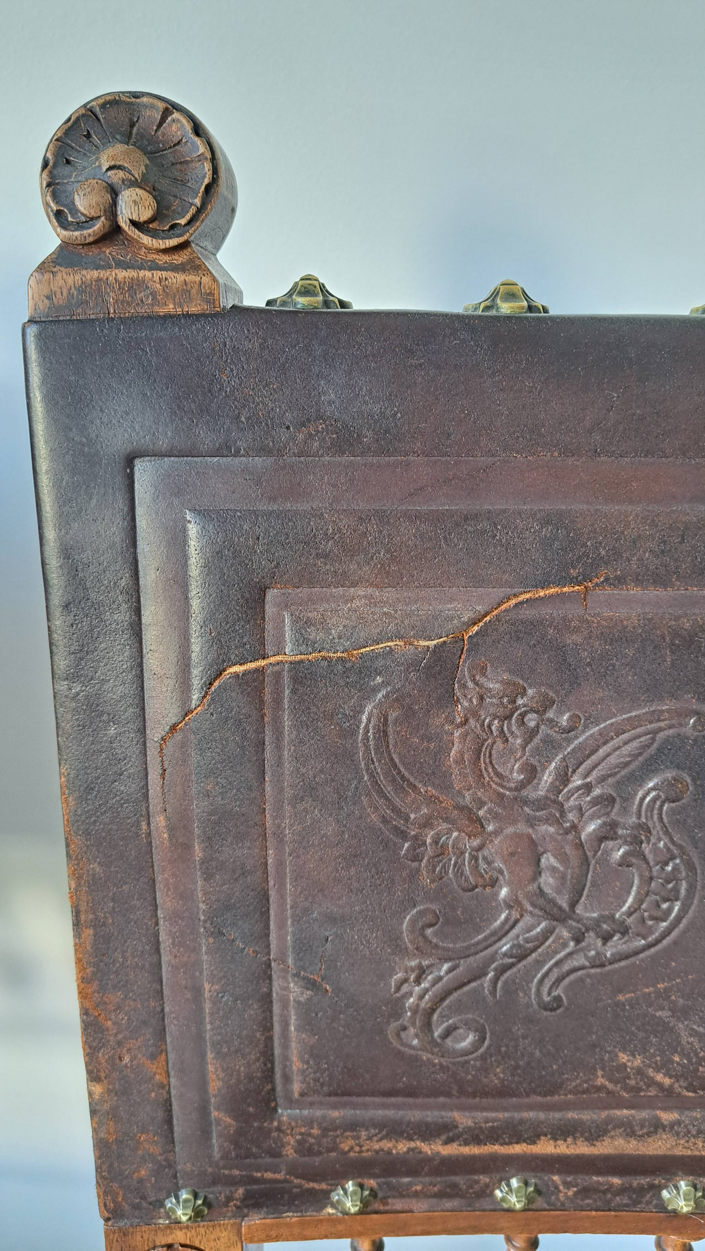 Pair of antique chairs in embossed leather, Henri II style.