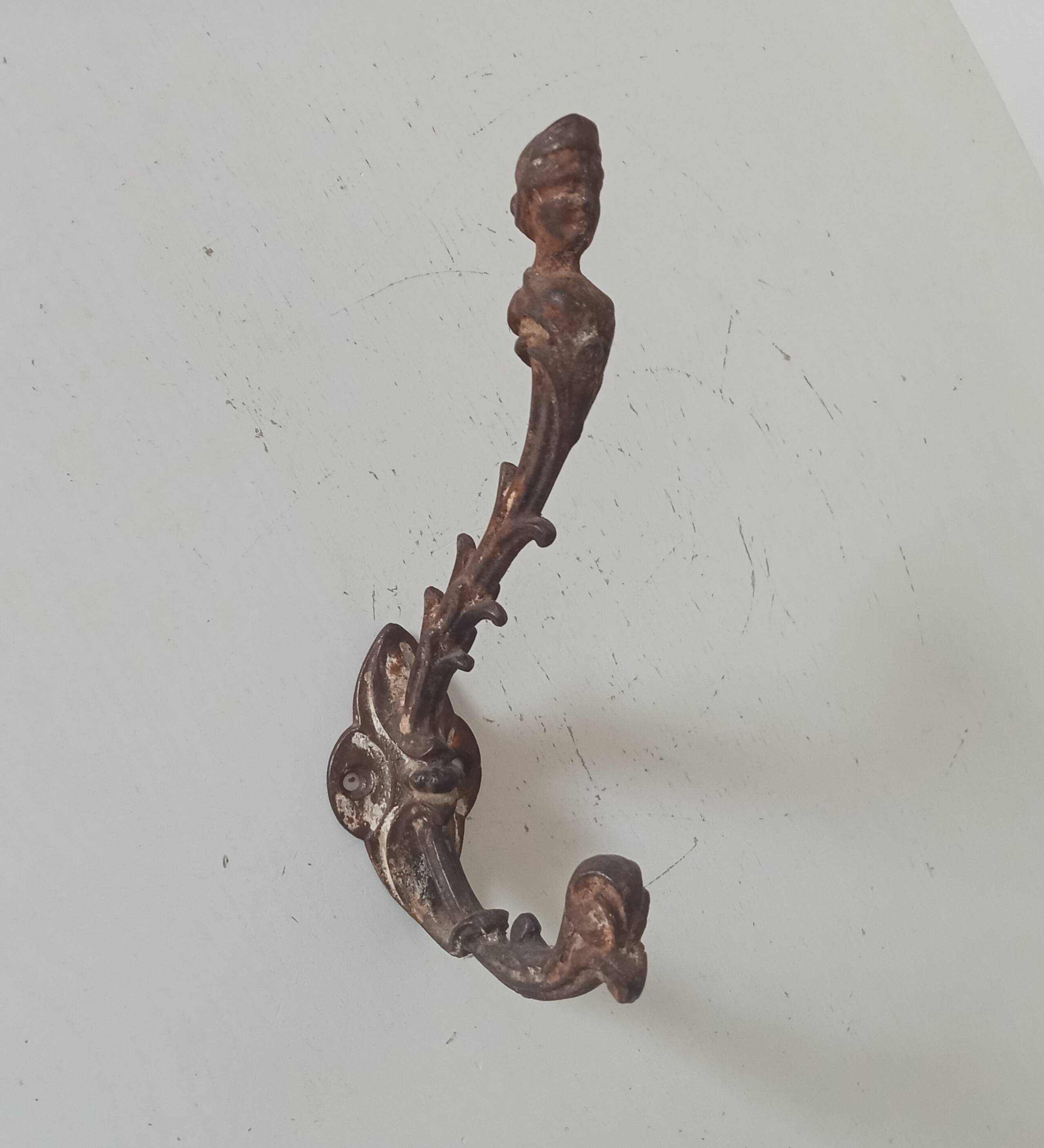 Antique wall coat hook from the 19th century in Victorian cast iron style.