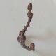 Antique wall coat hook from the 19th century in Victorian cast iron style.