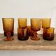 8 mismatched vintage amber glasses