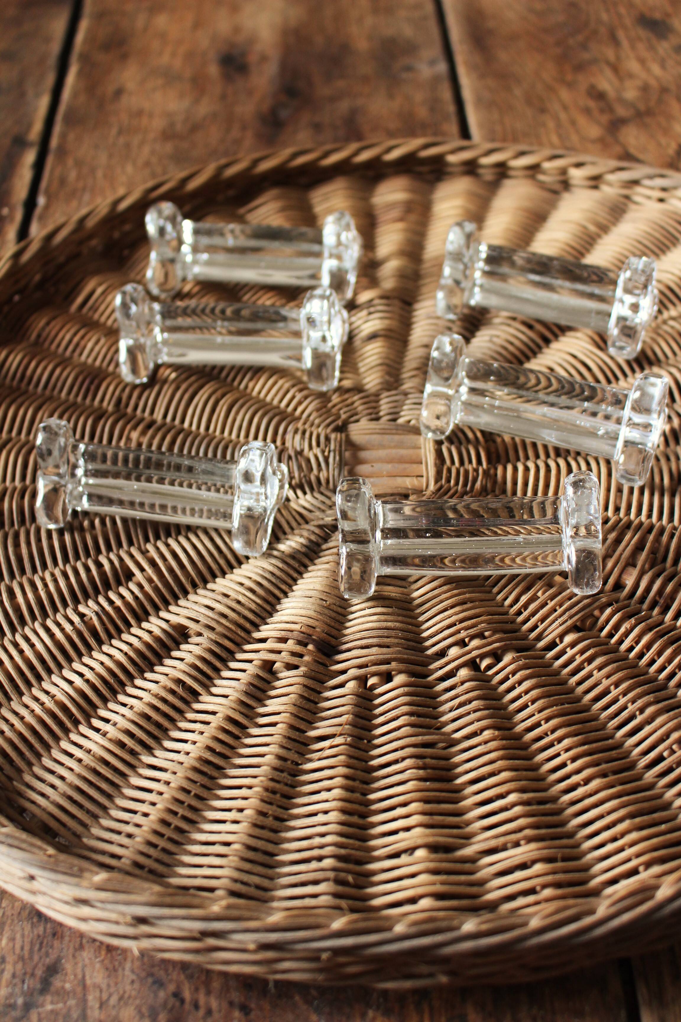 A set of 6 antique transparent trilobed glass knife holders