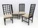 Quatre chaises à dossier haut laquées noires, 1979