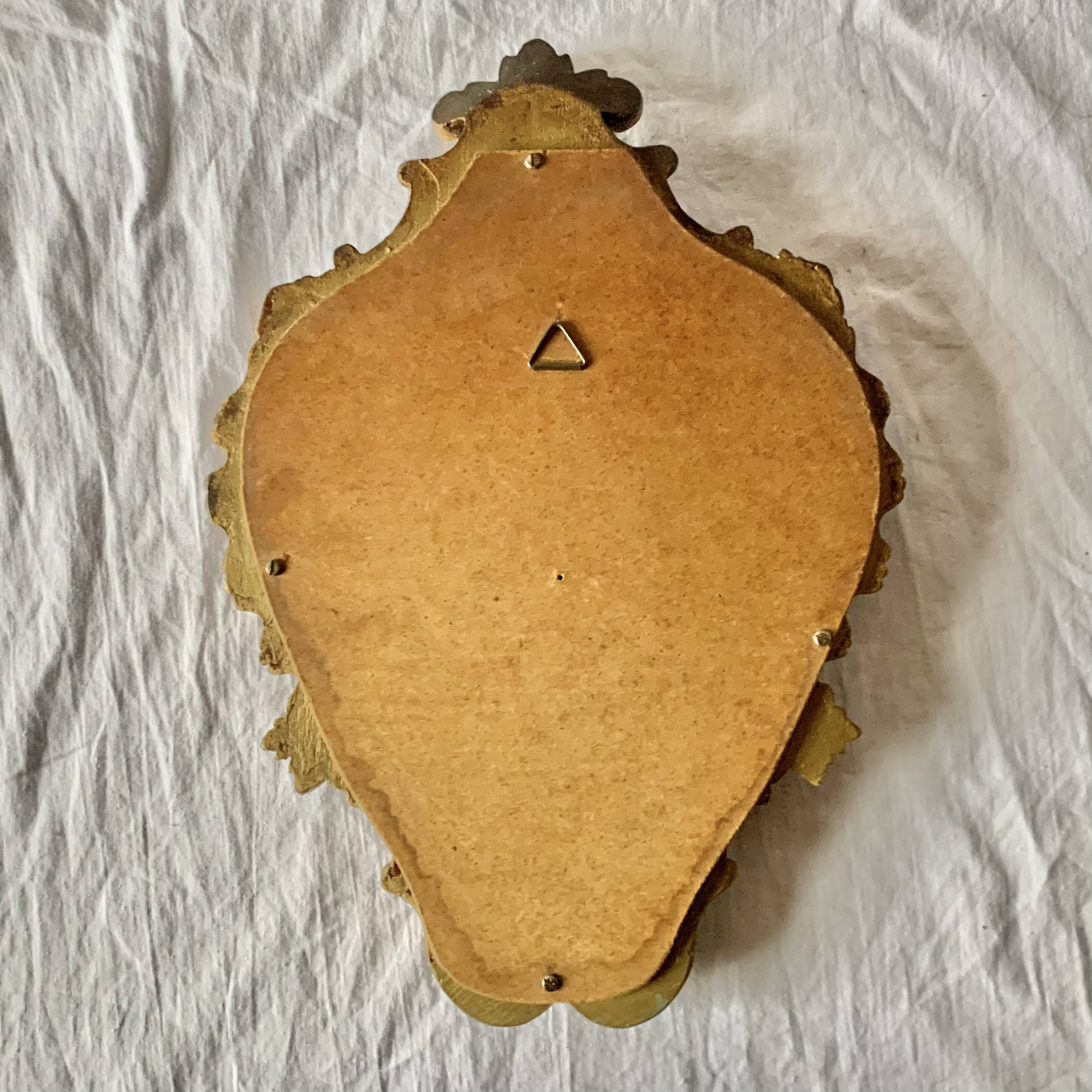 Rococo wall mirror in golden resin