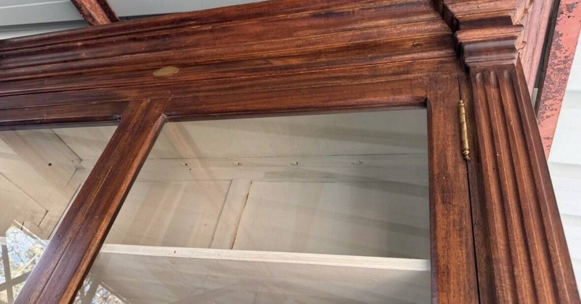Pair of teak colonial-style bookshelves / display cabinets.