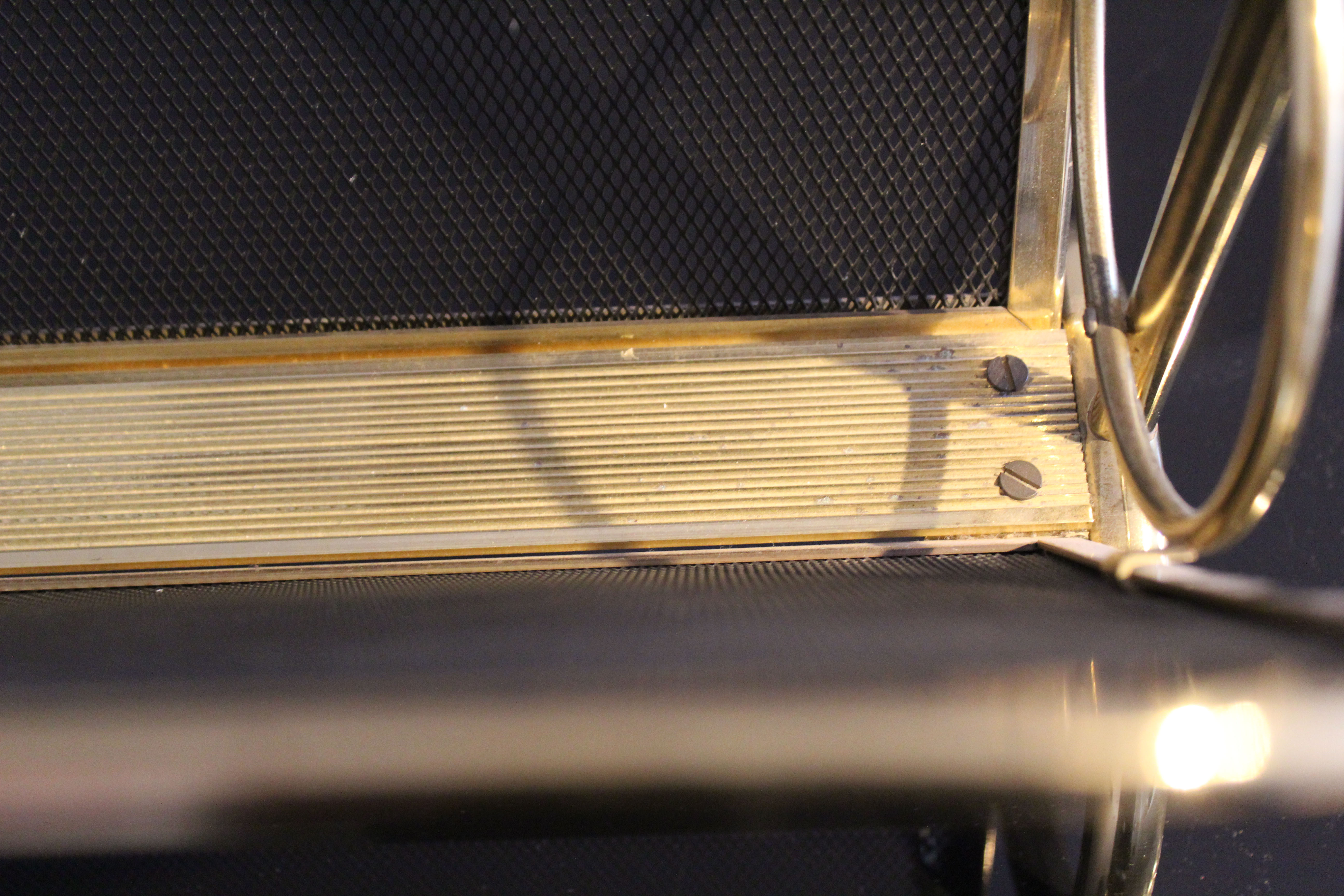 Magazine rack in brass and black lacquered metal, Italy 1970s