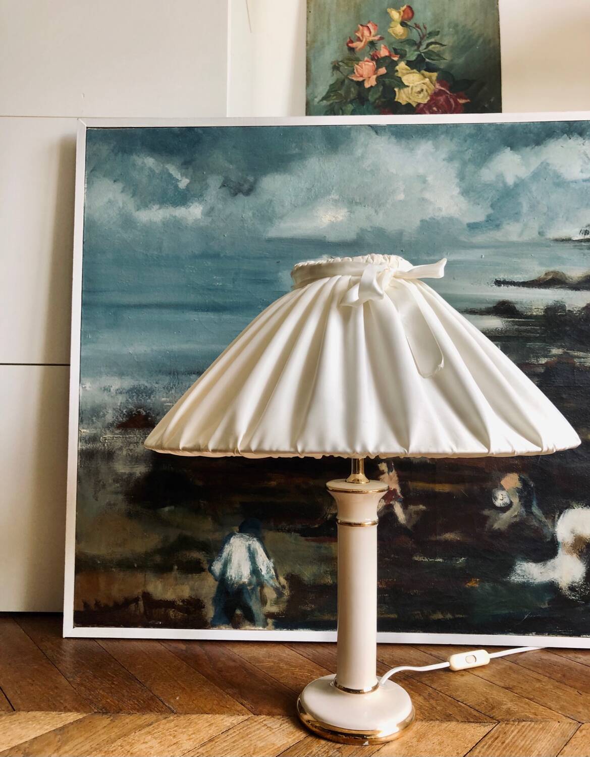 Vintage ivory ceramic lamp with gilding.