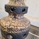Ceramic lamp with openwork design and double lighting