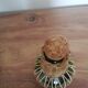 Bottle dressed in woven wicker