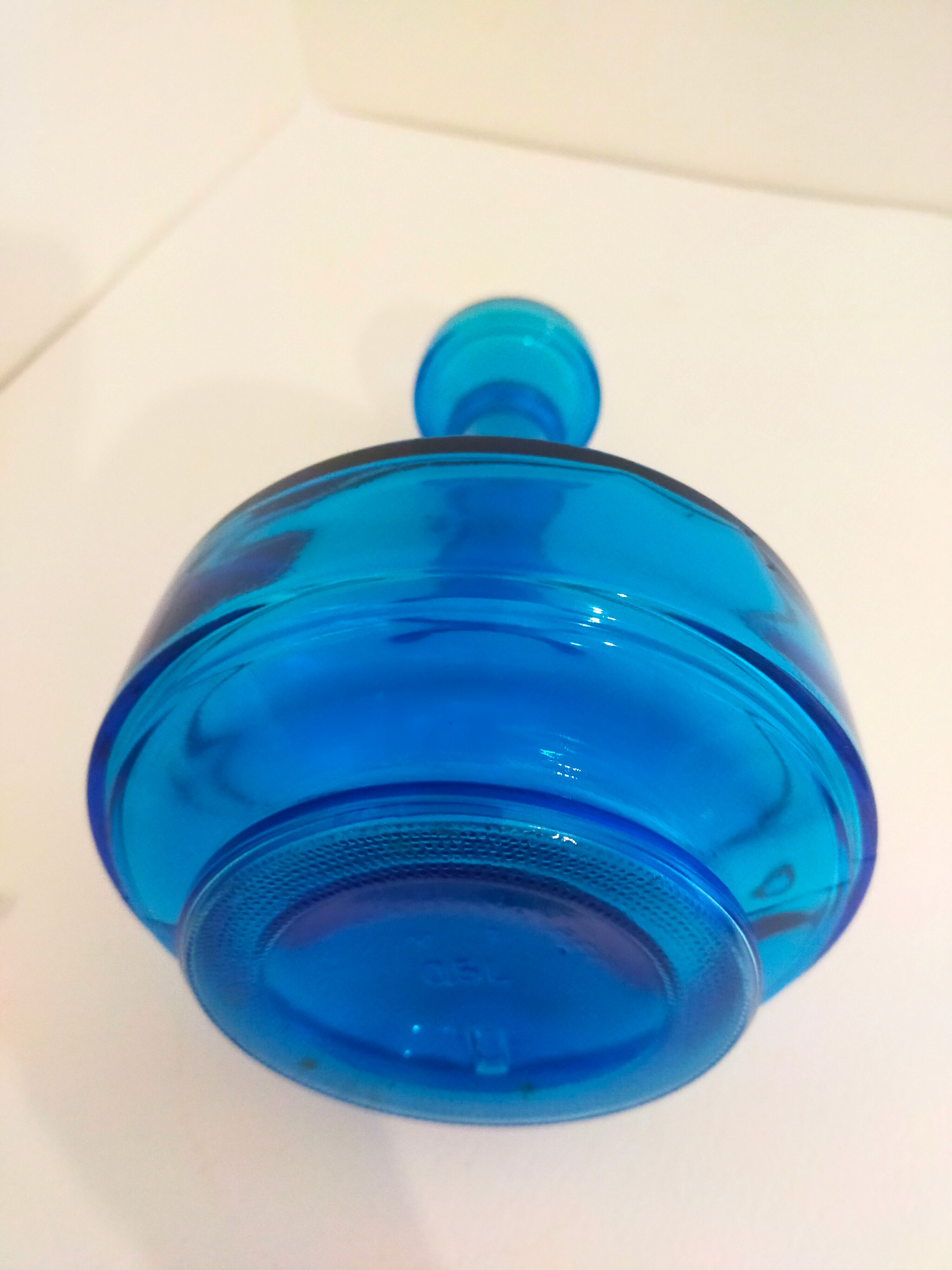 Bottle of old perfume of blue color