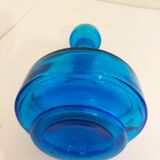 Bottle of old perfume of blue color