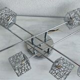 Articulated chromed metal luminaire