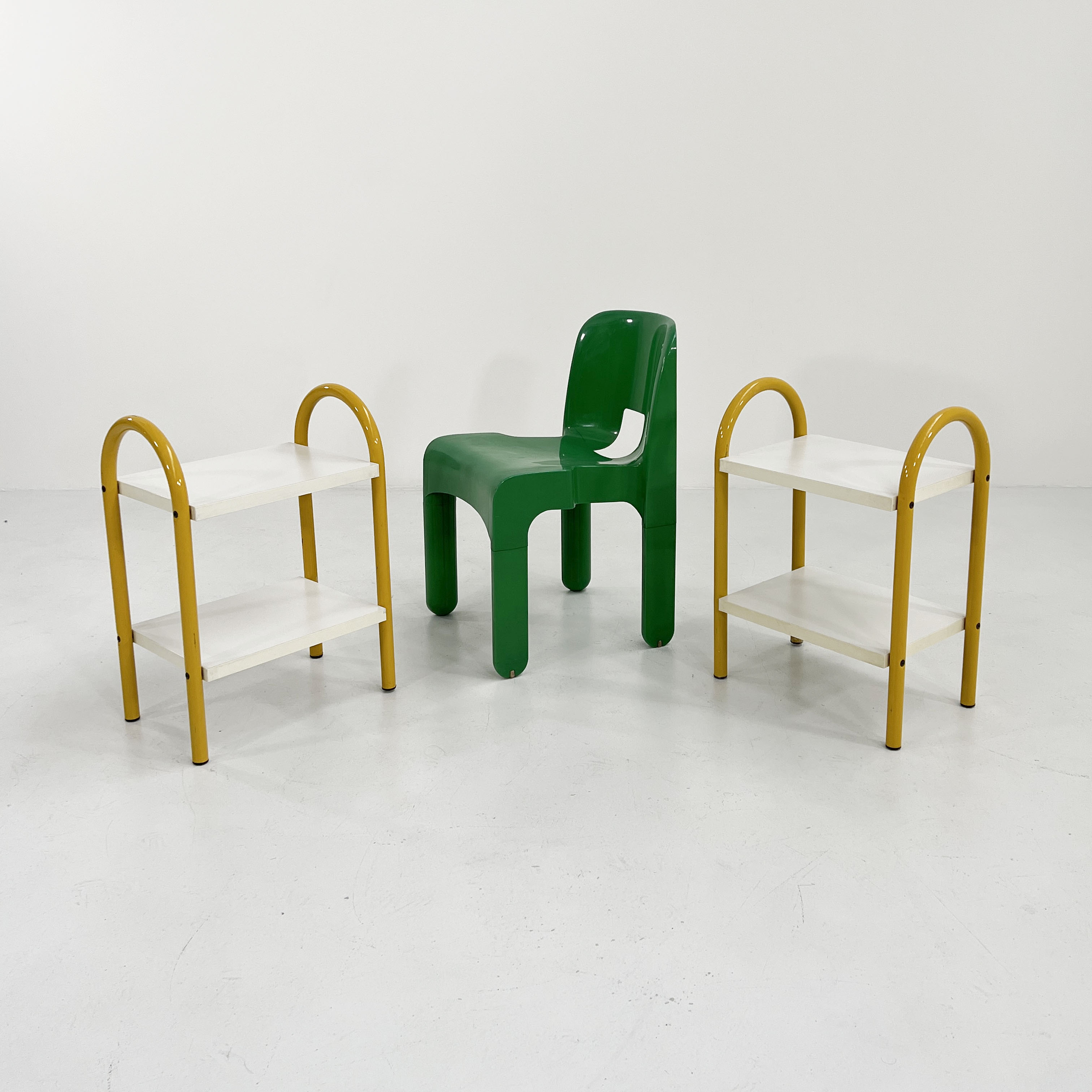 Pair of yellow tubular bedside tables, 1980