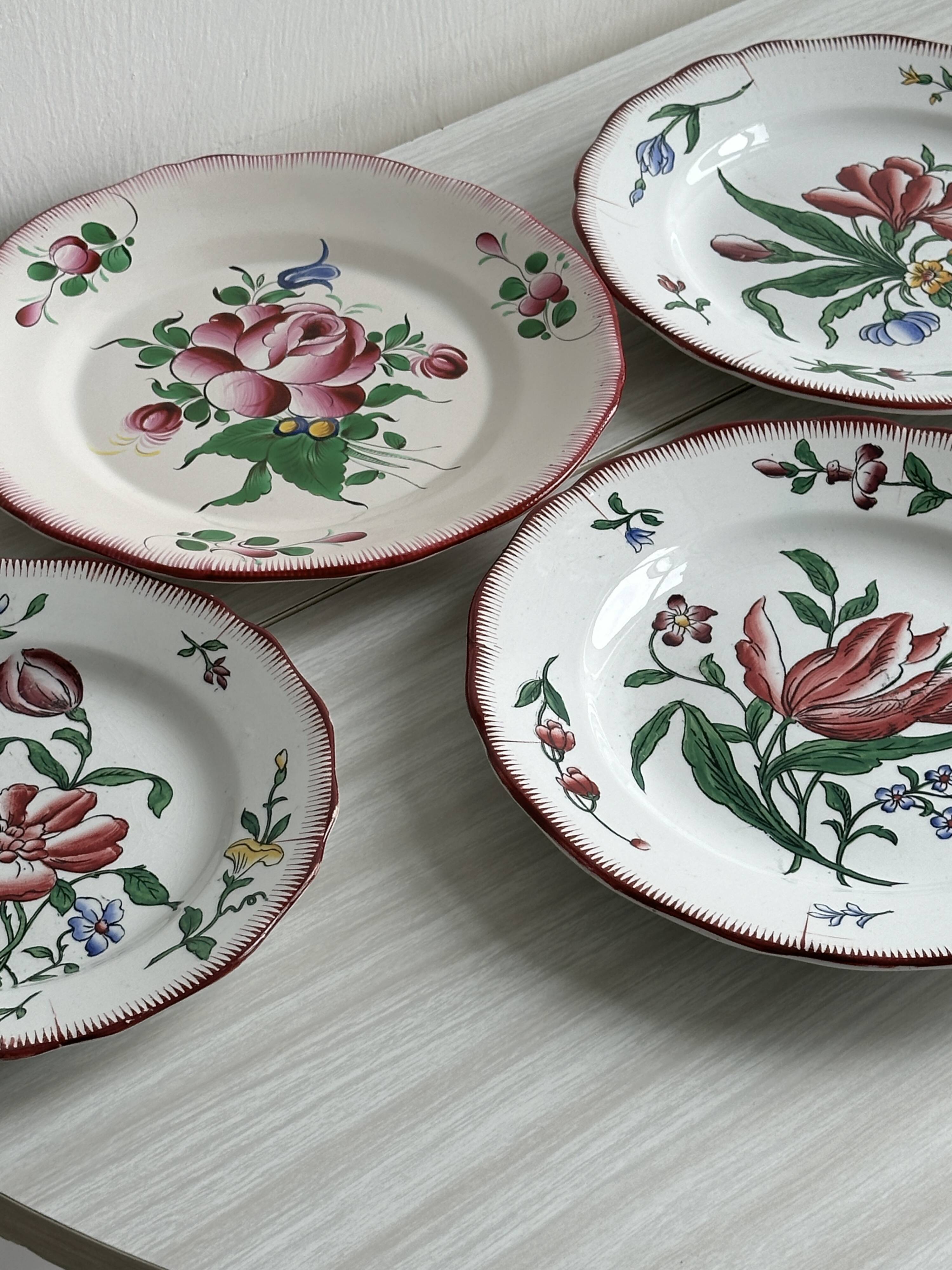 5 plates with colorful Sarreguemines floral designs.