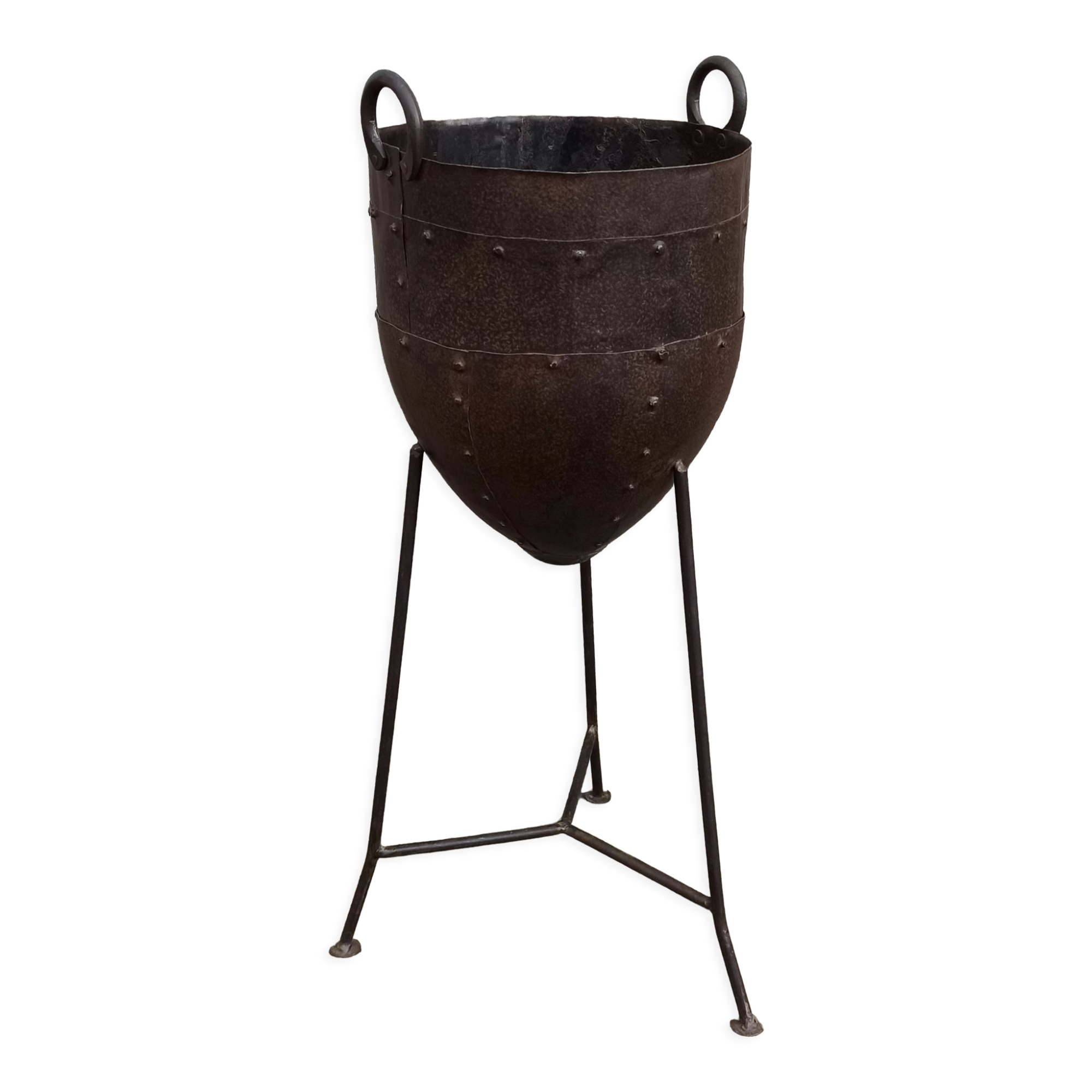 Old metal pot on foot