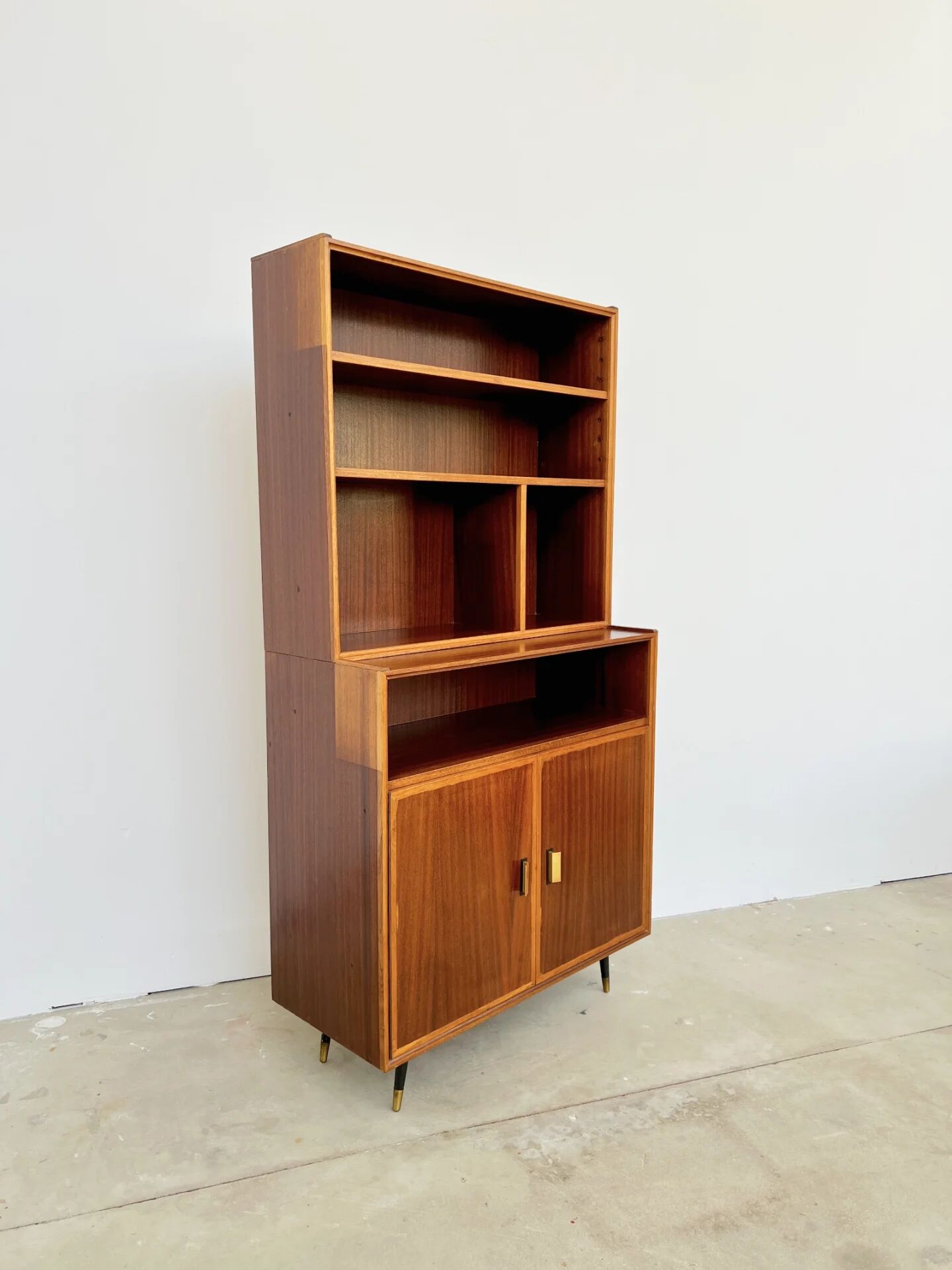 Mahogany library — closed storage and open cubbies, custom-made, 1960s.