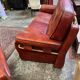 living room in patinated leather and brass from the 80s