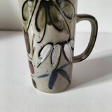 Glazed stoneware mug with free decoration, vintage pottery work.
