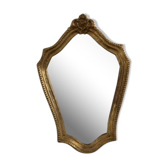 mirror, gilded wood, early 20th century, beaded outline, topped with a shell, scalloped shape, decoration