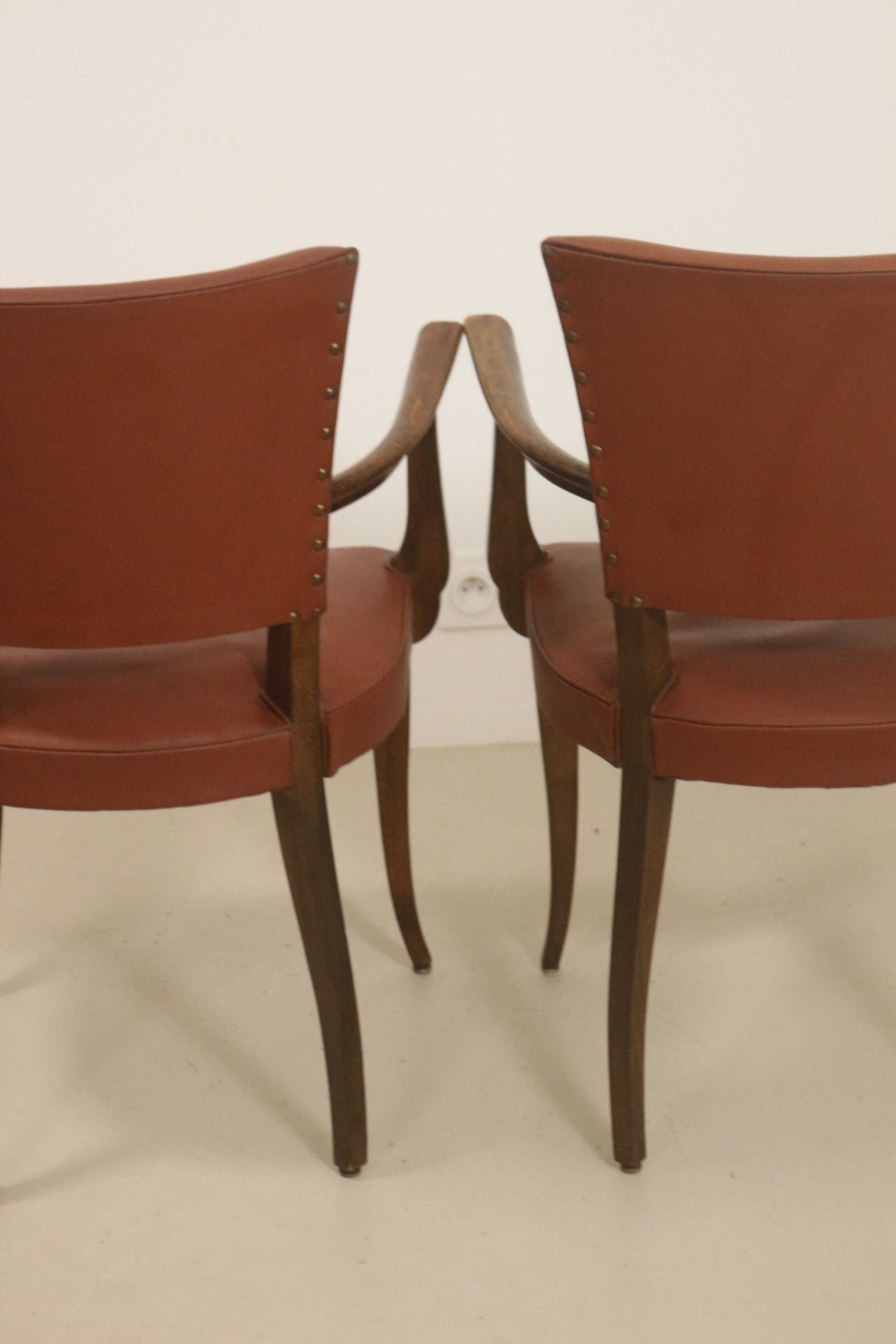 Pair of vintage bridge armchairs year 60 in imitation rust leather.