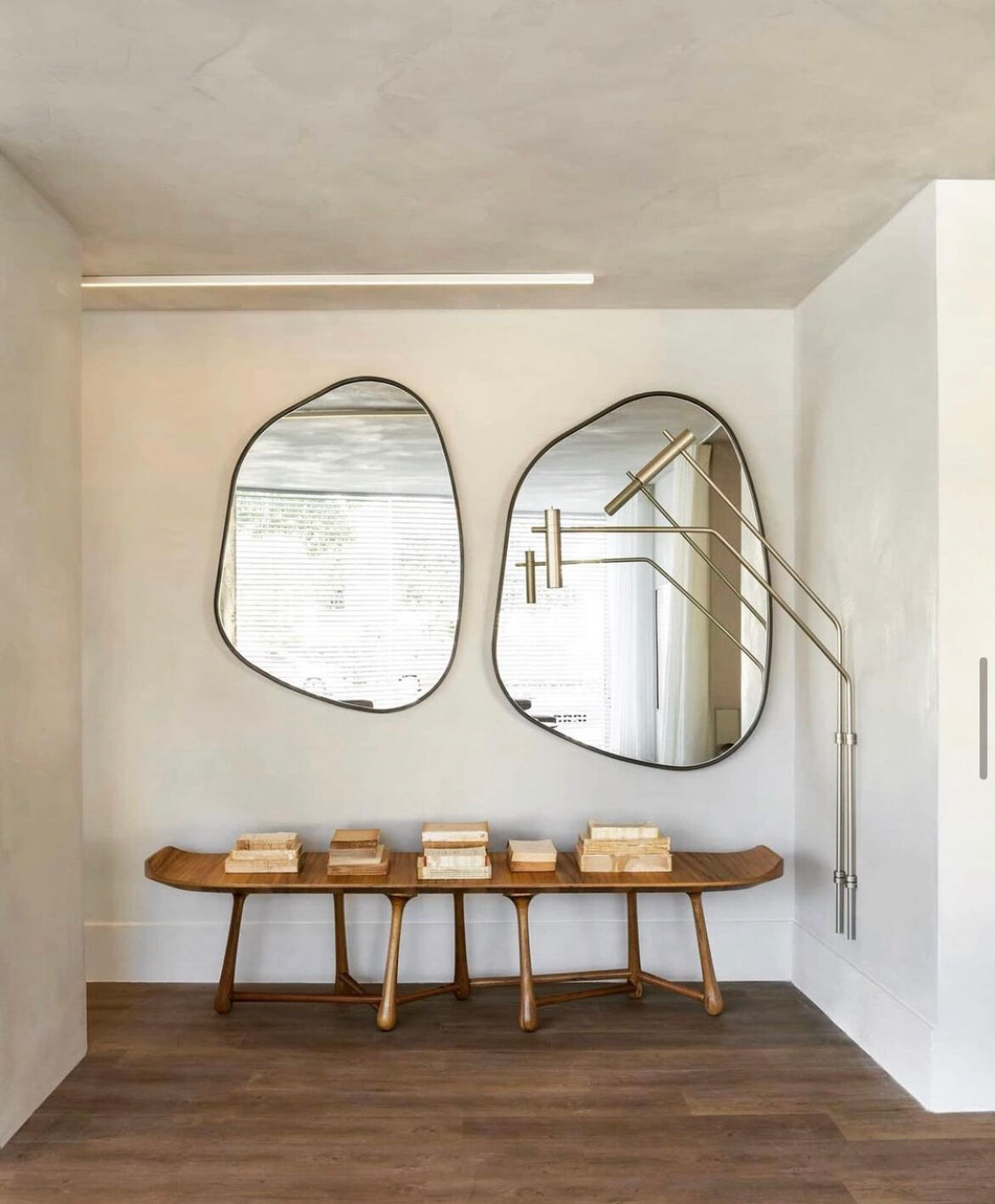 Irregular trapeze mirror organic brass black minimalist