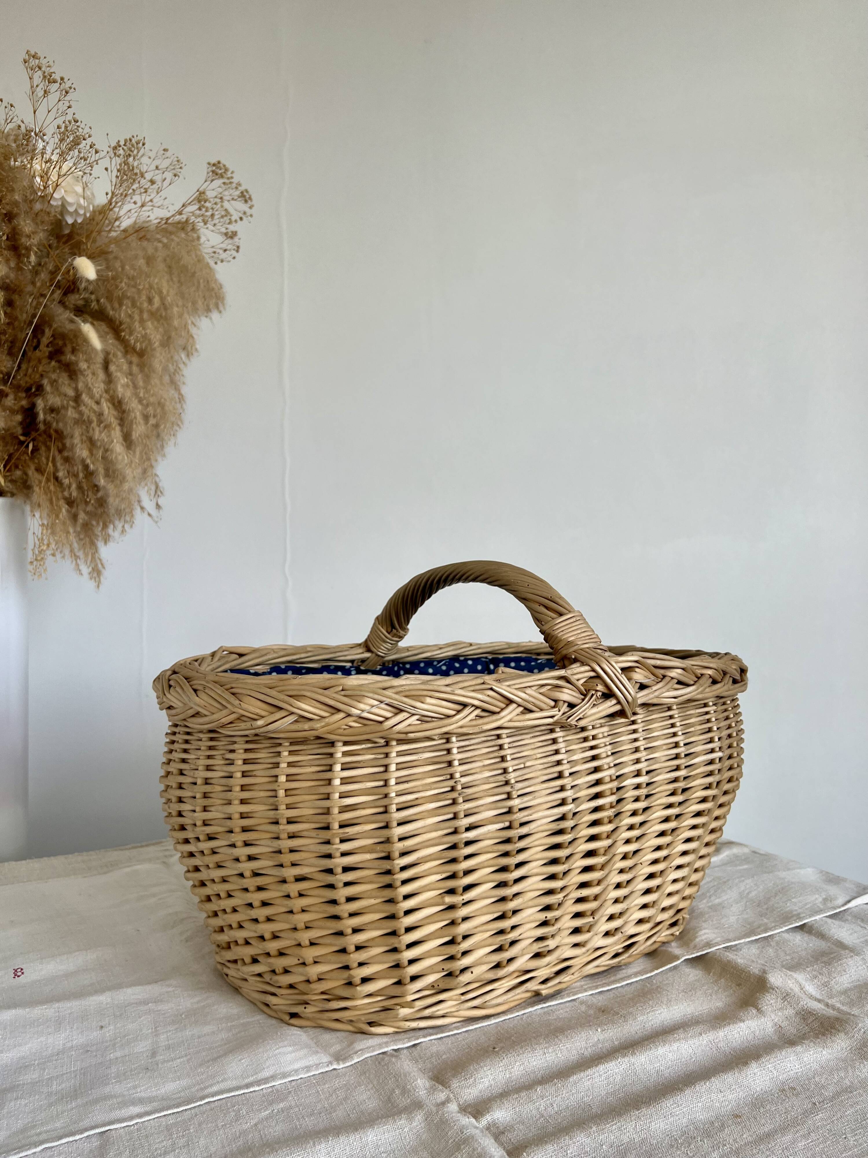 Large vintage wicker basket and blue lining with white polka dots