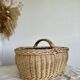 Large vintage wicker basket and blue lining with white polka dots