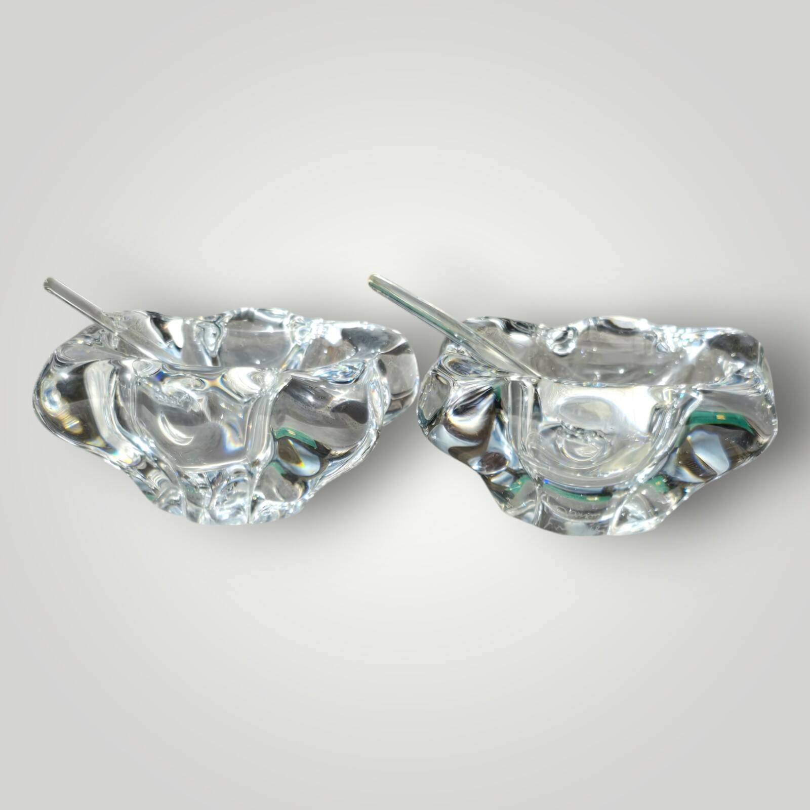 Pair of crystal salt shakers and glass spoons signed Daum Cristal