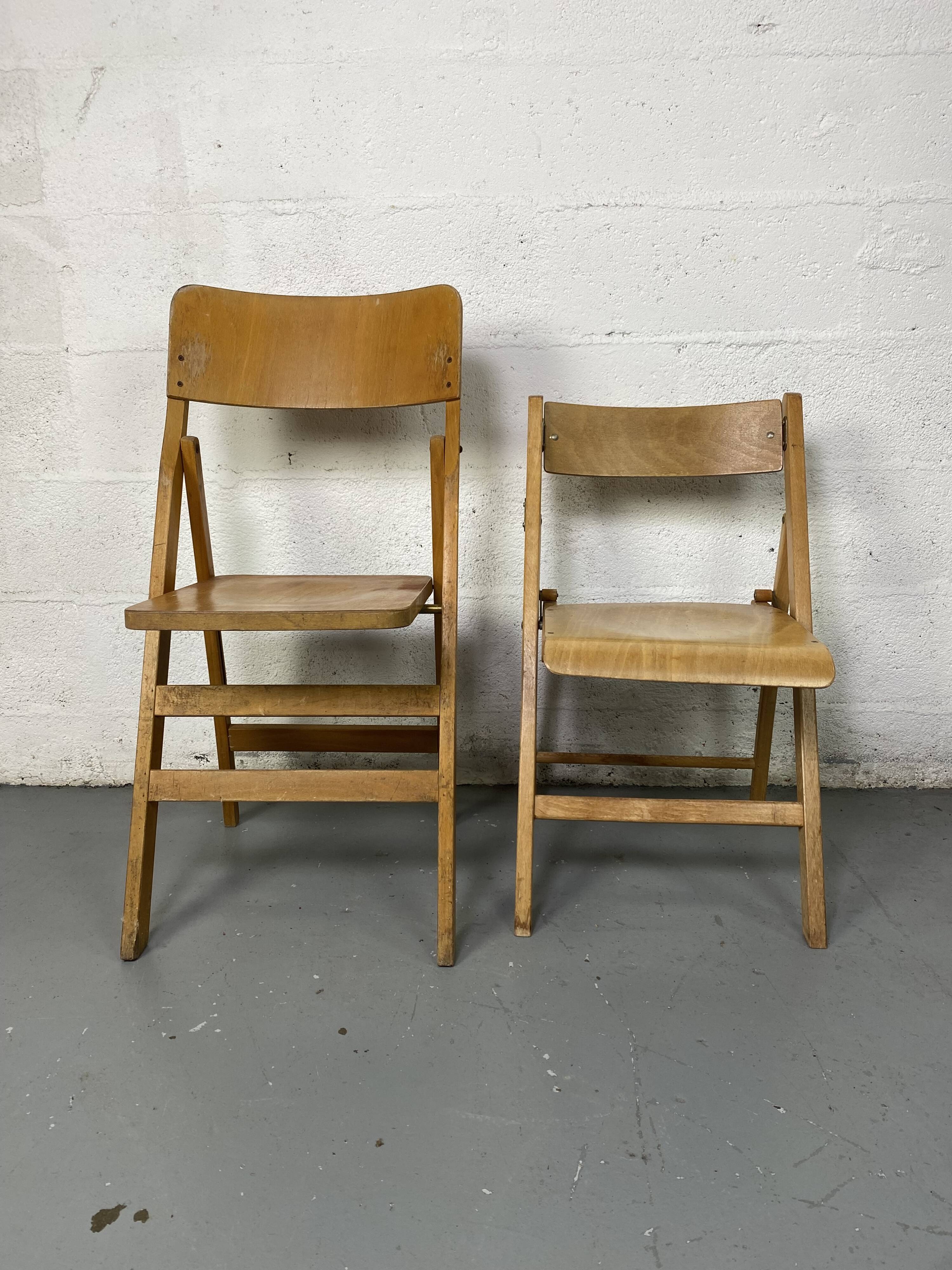 Pair of mismatched wooden folding chairs