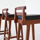 Erik Buck set of three bar stools in teak and leather Dyrlund Denmark 1960