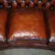 Curved Chesterfield canapé in hand-dyed vintage leather, fully restored.