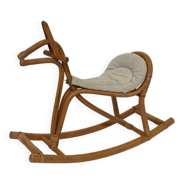 Vintage rattan rocking horse for a 1960s nursery design